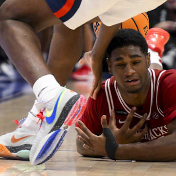 Ole Miss Rebels forward Malik Dia steals the ball from Arkansas Razorbacks forward Billy Richmond III during the second half at Bridgestone Arena.