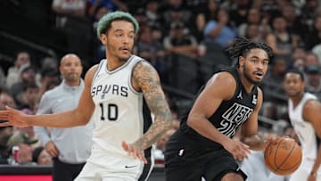 Mar 4, 2025; San Antonio, Texas, USA;  Brooklyn Nets guard Cam Thomas (24) dribbles against San Antonio Spurs forward Jeremy Sochan (10) in the second half at Frost Bank Center. Mandatory Credit: Daniel Dunn-Imagn Images