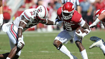South Carolina linebacker Mo Kaba tackling new Gamecock teammate Rocket Sanders when the latter played for the Arkansas Razorbacks