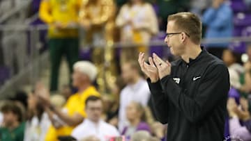 TCU women's basketball head coach Mark Campbell claps in excitement in a win over Baylor on January 26, 2025.