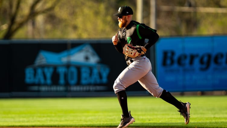 Dayton's Blake Dunn runs to the dugout