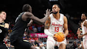 Mar 13, 2025; Kansas City, MO, USA; Houston Cougars forward J'Wan Roberts (13) brings the ball up court during the first half against the Colorado Buffaloes at T-Mobile Center. Mandatory Credit: William Purnell-Imagn Images