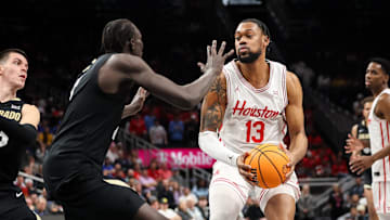 Mar 13, 2025; Kansas City, MO, USA; Houston Cougars forward J'Wan Roberts (13) brings the ball up court during the first half against the Colorado Buffaloes at T-Mobile Center. Mandatory Credit: William Purnell-Imagn Images