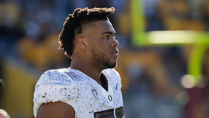 Nov 18, 2023; Tempe, Arizona, USA; Oregon Ducks offensive lineman Ajani Cornelius (65) against the Arizona State Sun Devils at Mountain America Stadium. Mandatory Credit: Mark J. Rebilas-Imagn Images