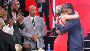  Collin Murray-Boyles embraces girlfriend Chloe Kitts after being selected as the ninth pick by the Toronto Raptors in the first round of the 2025 NBA Draft at Barclays Center. 
