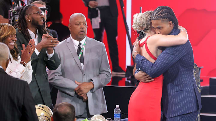  Collin Murray-Boyles embraces girlfriend Chloe Kitts after being selected as the ninth pick by the Toronto Raptors in the first round of the 2025 NBA Draft at Barclays Center. 