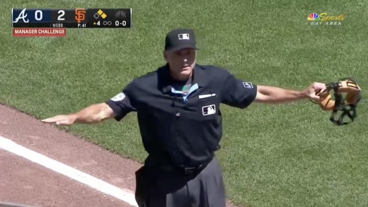 An umpire calls a runner safe during the Atlanta Braves vs. San Francisco Giants game on August 15, 2024.