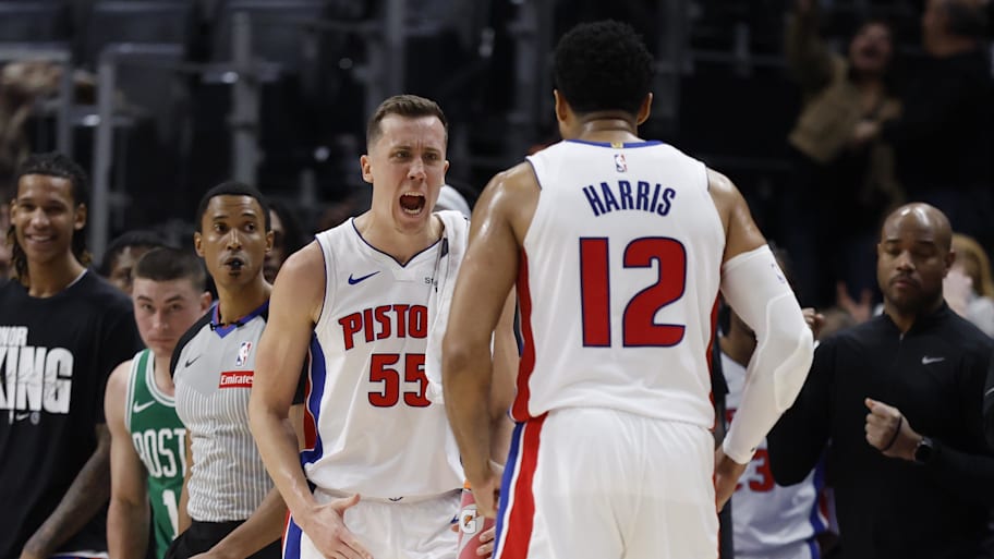 Pistons forward Duncan Robinson celebrates with forward Tobias Harris after defeating the Celtics.