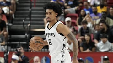 Jul 12, 2025; Las Vegas, NV, USA; San Antonio Spurs guard Dylan Harper (2) dribbles the ball against the Dallas Mavericks in the first quarter of their game at Thomas & Mack Center.