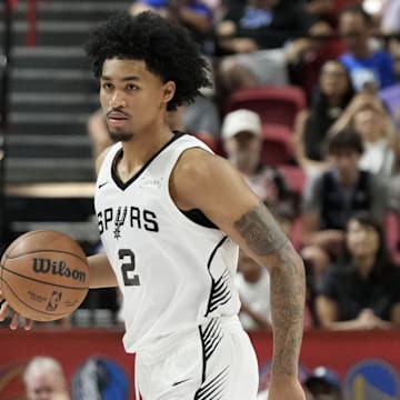 Jul 12, 2025; Las Vegas, NV, USA; San Antonio Spurs guard Dylan Harper (2) dribbles the ball against the Dallas Mavericks in the first quarter of their game at Thomas & Mack Center.