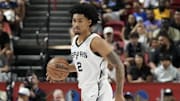 Jul 12, 2025; Las Vegas, NV, USA; San Antonio Spurs guard Dylan Harper (2) dribbles the ball against the Dallas Mavericks in the first quarter of their game at Thomas & Mack Center. Mandatory Credit: Candice Ward-Imagn Images