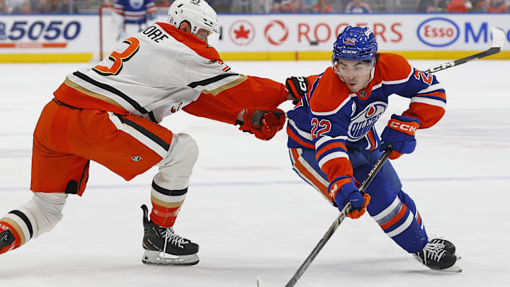 Mar 28, 2026; Edmonton, Alberta, CAN; Edmonton Oilersforward Matt Savoie (22) carries the puck around Anaheim Ducks defensemen Ian Moore (3) during the first period at Rogers Place. Mandatory Credit: Perry Nelson-Imagn Images