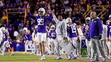Nov 30, 2024; Baton Rouge, Louisiana, USA;  LSU Tigers defensive tackle Gio Paez (99) and head coach Brian Kelly react to a field goal made against the Oklahoma Sooners during the fourth quarter at Tiger Stadium. Mandatory Credit: Stephen Lew-Imagn Images