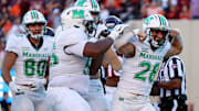 Sep 7, 2024; Blacksburg, Virginia, USA; Marshall Thundering Herd running back Ethan Payne (28) celebrates after scoring a touchdown during the second quarter against the Virginia Tech Hokies at Lane Stadium. Mandatory Credit: Peter Casey-Imagn Images