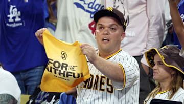 Oct 6, 2024; Los Angeles, California, USA; San Diego Padres fans cheer in the seventh inning against the Los Angeles Dodgers during game two of the NLDS for the 2024 MLB Playoffs at Dodger Stadium. 