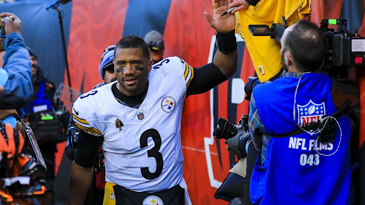 Pittsburgh Steelers quarterback Russell Wilson high fives fans after the victory over the Cincinnati Bengals.