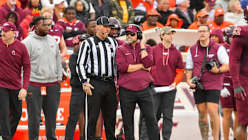 Nov 9, 2024; Blacksburg, Virginia, USA;  Virginia Tech Hokies head coach Brent Pry talks to an official during the second quarter against the Clemson Tigers at Lane Stadium. Mandatory Credit: Brian Bishop-Imagn Images