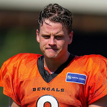 Cincinnati Bengals quarterback Joe Burrow (9) sets up between plays during a preseason training camp practice in downtown Cincinnati on Wednesday, July 30, 2025.