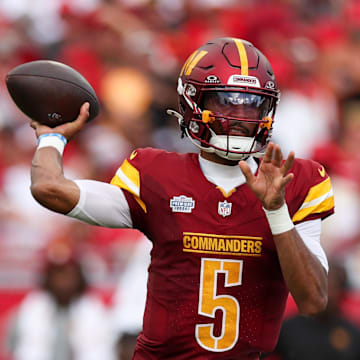 Sep 8, 2024; Tampa, Florida, USA; Washington Commanders quarterback Jayden Daniels (5) drops back to pass against the Tampa Bay Buccaneers in the third quarter at Raymond James Stadium. Mandatory Credit: Nathan Ray Seebeck-Imagn Images