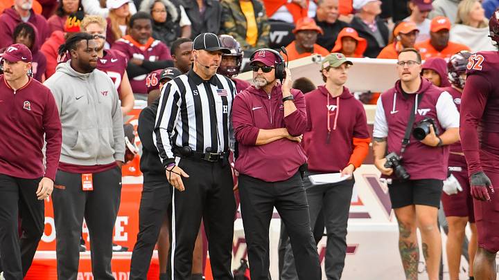 Nov 9, 2024; Blacksburg, Virginia, USA;  Virginia Tech Hokies head coach Brent Pry talks to an official during the second quarter against the Clemson Tigers at Lane Stadium. Mandatory Credit: Brian Bishop-Imagn Images