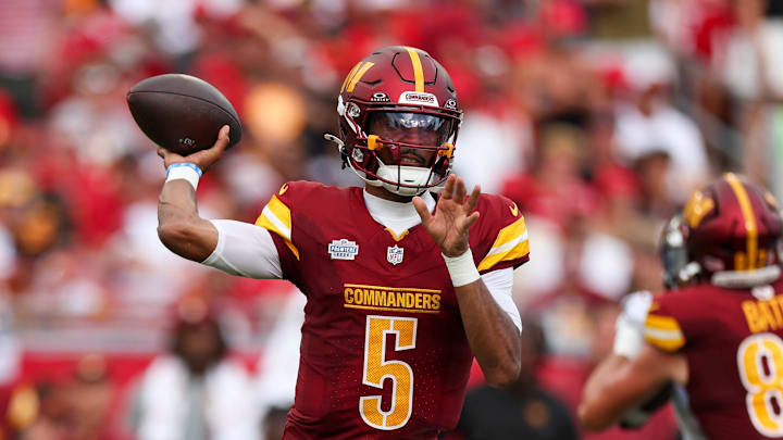 Sep 8, 2024; Tampa, Florida, USA; Washington Commanders quarterback Jayden Daniels (5) drops back to pass against the Tampa Bay Buccaneers in the third quarter at Raymond James Stadium. Mandatory Credit: Nathan Ray Seebeck-Imagn Images