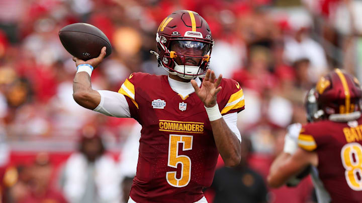 Sep 8, 2024; Tampa, Florida, USA; Washington Commanders quarterback Jayden Daniels (5) drops back to pass against the Tampa Bay Buccaneers in the third quarter at Raymond James Stadium. 