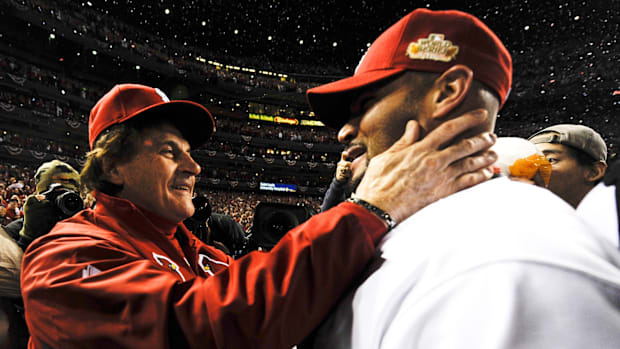 St. Louis Cardinals manager Tony La Russa greets St. Louis Cardinals Albert Pujols after winning the World Series