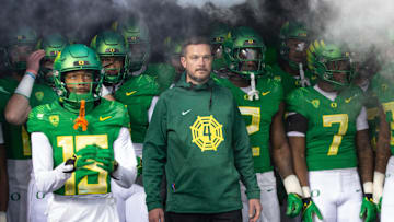 Oregon head coach Dan Lanning, center, waits to take the field with his team for their game against Oregon State at Autzen Stadium Friday, Nov. 24, 2023.