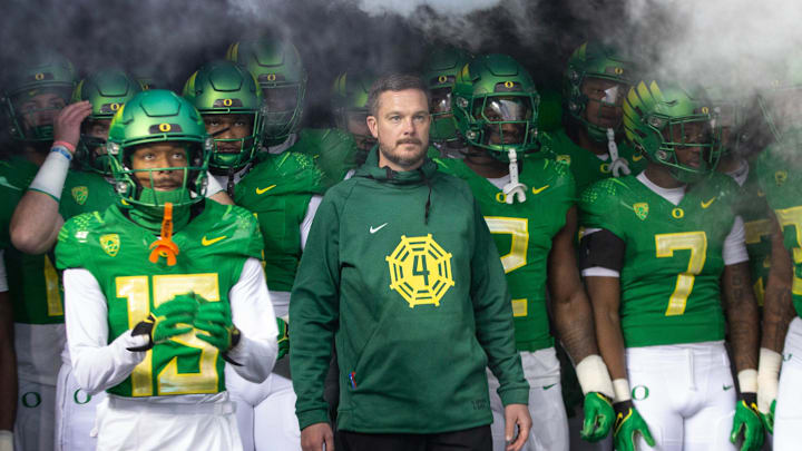 Oregon head coach Dan Lanning, center, waits to take the field with his team for their game against Oregon State at Autzen Stadium Friday, Nov. 24, 2023.
