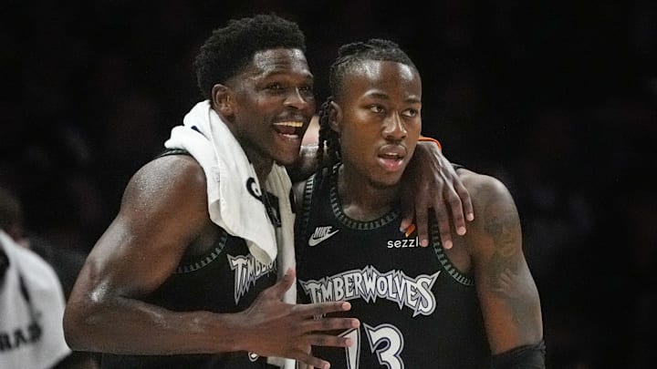 Apr 23, 2026; Minneapolis, Minnesota, USA; Minnesota Timberwolves guard Anthony Edwards (5) talks with guard Ayo Dosunmu (13) during a free throw by the Denver Nuggets in the first quarter at Target Center. Mandatory Credit: Bruce Kluckhohn-Imagn Images