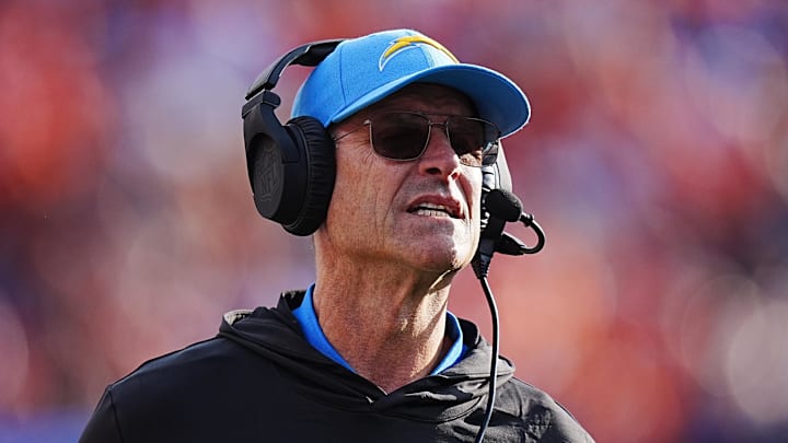 Los Angeles Chargers head coach Jim Harbaugh stands on the sidelines during a game.