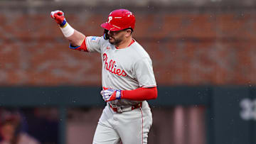 Apr 10, 2025; Atlanta, Georgia, USA; Philadelphia Phillies designated hitter Kyle Schwarber (12) celebrates after a home run against the Atlanta Braves in the third inning at Truist Park. 