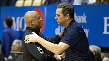 Jan 25, 2025; Berkeley, California, USA; Miami Hurricanes interim head coach Bill Courtney (left) greets California Golden Bears head coach Mark Madsen before their game at Haas Pavilion. Mandatory Credit: D. Ross Cameron-Imagn Images