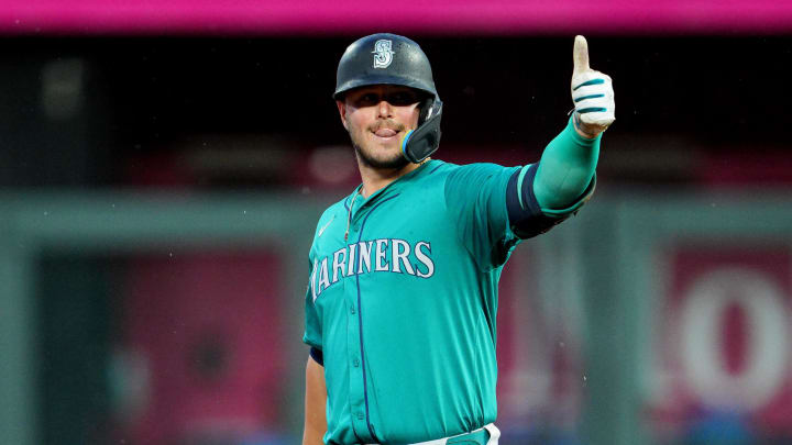 Seattle Mariners first baseman Ty France (23) gestures to the dugout after hitting an RBI double during the fourth inning against the Kansas City Royals at Kauffman Stadium on June 7.