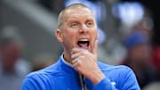 Kentucky Wildcats head coach Mark Pope watches as the Cards go up on Kentucky in the first half during the UofL-UK annual rivalry game at the KFC Yum! Center in Louisville, Kentucky Nov. 11, 2025.