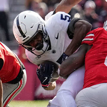 Ohio State Buckeyes linebacker Arvell Reese (8) hits Penn State Nittany Lions wide receiver Devonte Ross (5) beside cornerback Lorenzo Styles Jr. (3) during the NCAA football game at Ohio Stadium in Columbus on Nov. 1, 2025.