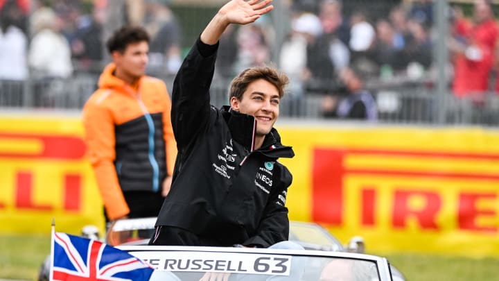 Jun 18, 2023; Montreal, Quebec, CAN; Mercedes driver George Russell (GBR) parades and salutes the crowd before the Canadian Grand Prix at Circuit Gilles Villeneuve. Mandatory Credit: David Kirouac-USA TODAY Sports