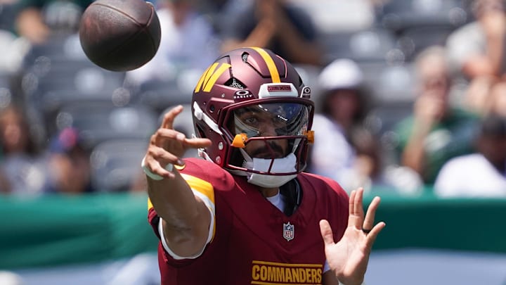 Aug 10, 2024; East Rutherford, New Jersey, USA; Washington Commanders quarterback Marcus Mariota (0) passes during the first quarter against the New York Jets at MetLife Stadium. Mandatory Credit: Lucas Boland-Imagn Images