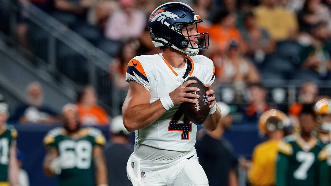 Aug 21, 2026; Denver, Colorado, USA; Denver Broncos quarterback Sam Ehlinger (4) drops back in the fourth quarter against the Green Bay Packers at Empower Field at Mile High. Aug 21, 2026; Denver, Colorado, USA; Denver Broncos quarterback Sam Ehlinger (4) drops back in the fourth quarter against the Green Bay Packers at Empower Field at Mile High.
