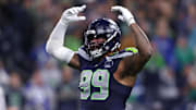 Oct 20, 2025; Seattle, Washington, USA; Seattle Seahawks defensive end Leonard Williams (99) celebrates after a play during the fourth quarter against the Houston Texans at Lumen Field. Mandatory Credit: Kevin Ng-Imagn Images