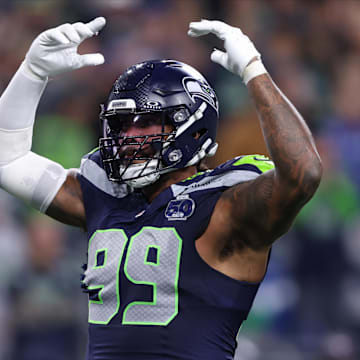 Oct 20, 2025; Seattle, Washington, USA; Seattle Seahawks defensive end Leonard Williams (99) celebrates after a play during the fourth quarter against the Houston Texans at Lumen Field. Mandatory Credit: Kevin Ng-Imagn Images