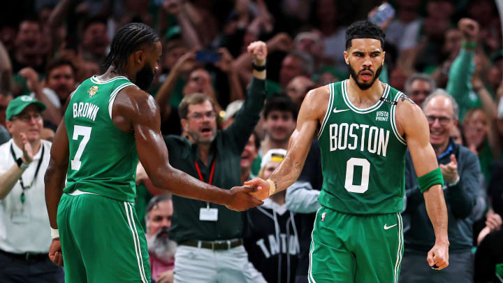 Jun 17, 2024; Boston, Massachusetts, USA; Boston Celtics forward Jayson Tatum (0) celebrates with guard Jaylen Brown (7) after a play against the Dallas Mavericks in game five of the 2024 NBA Finals at TD Garden. Mandatory Credit: Peter Casey-USA TODAY Sports