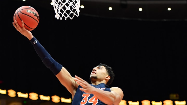 Mar 16, 2019; Anaheim, CA, USA; Cal State Fullerton Titans forward Jackson Rowe (34) drives to the basket against UC Irvine Anteaters forward Collin Welp (40) during the first half of the final of the Big West conference tournament at Honda Center. Mandatory Credit: Robert Hanashiro-USA TODAY Sports