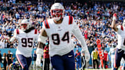New England Patriots defensive tackle Cory Durden (94) celebrates after linebacker K'Lavon Chaisson (44) ran in a Tennessee Titans fumble during the third quarter at Nissan Stadium in Nashville, Tenn., Sunday, Oct. 19, 2025.