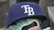 Sep 26, 2025; Toronto, Ontario, CAN; The hat and glove of Tampa Bay Rays third baseman Junior Caminero (13) in the dugout during the game against the Toronto Blue Jays at Rogers Centre. 