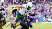 TCU Horned Frogs running back Jeremy Payne (26) is thrown down by Baylor Bears defensive lineman Cooper Lanz (9)