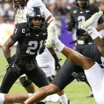 TCU linebacker Namdi Obiazor makes a tackle against Colorado. 
