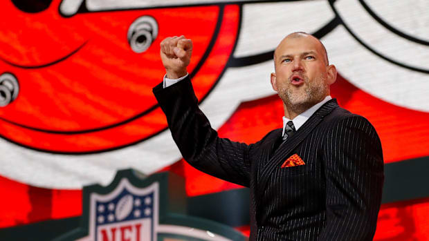 Hall of Fame former Cleveland Browns tackle Joe Thomas pumps his fist as he walks on stage to announce the Browns’ second rou