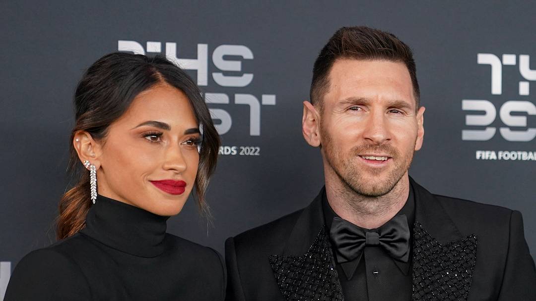 Lionel Messi and his wife Antonela Roccuzzo attend a red carpet event. 