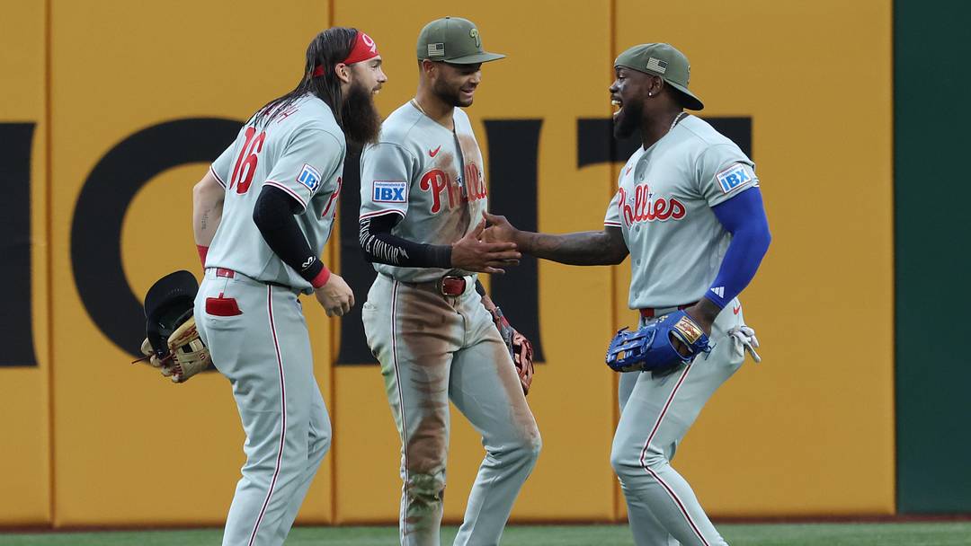 May 16, 2026; Pittsburgh, Pennsylvania, USA;  Philadelphia Phillies left fielder Brandon Marsh (16) and center fielder Justin Crawford (middle) and right fielder Adolis García (right) celebrate in the outfield after defeating the Pittsburgh Pirates at PNC Park. Mandatory Credit: Charles LeClaire-Imagn Images